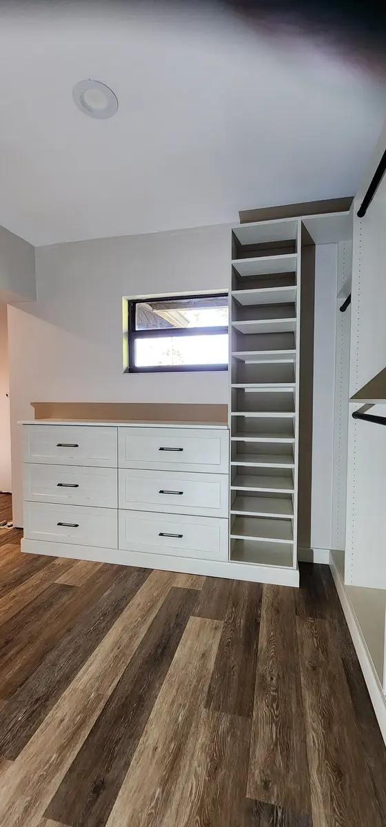 Installed closet system with a drawer bank and shelf tower
