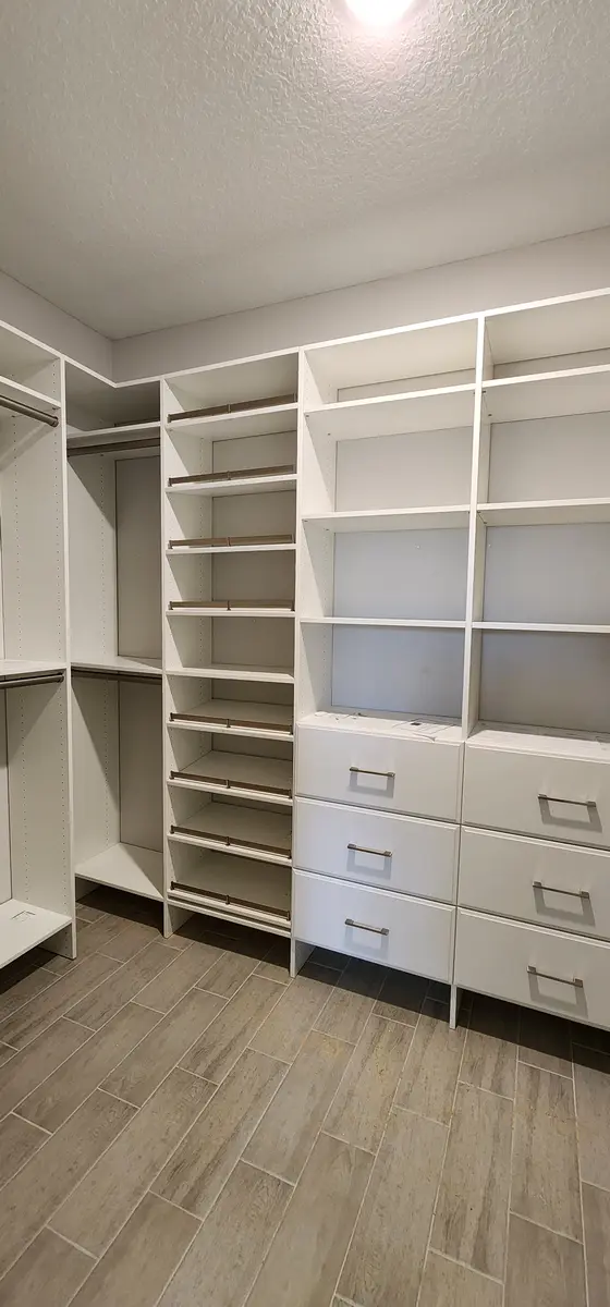 Installed closet system with a drawer bank and shelf tower