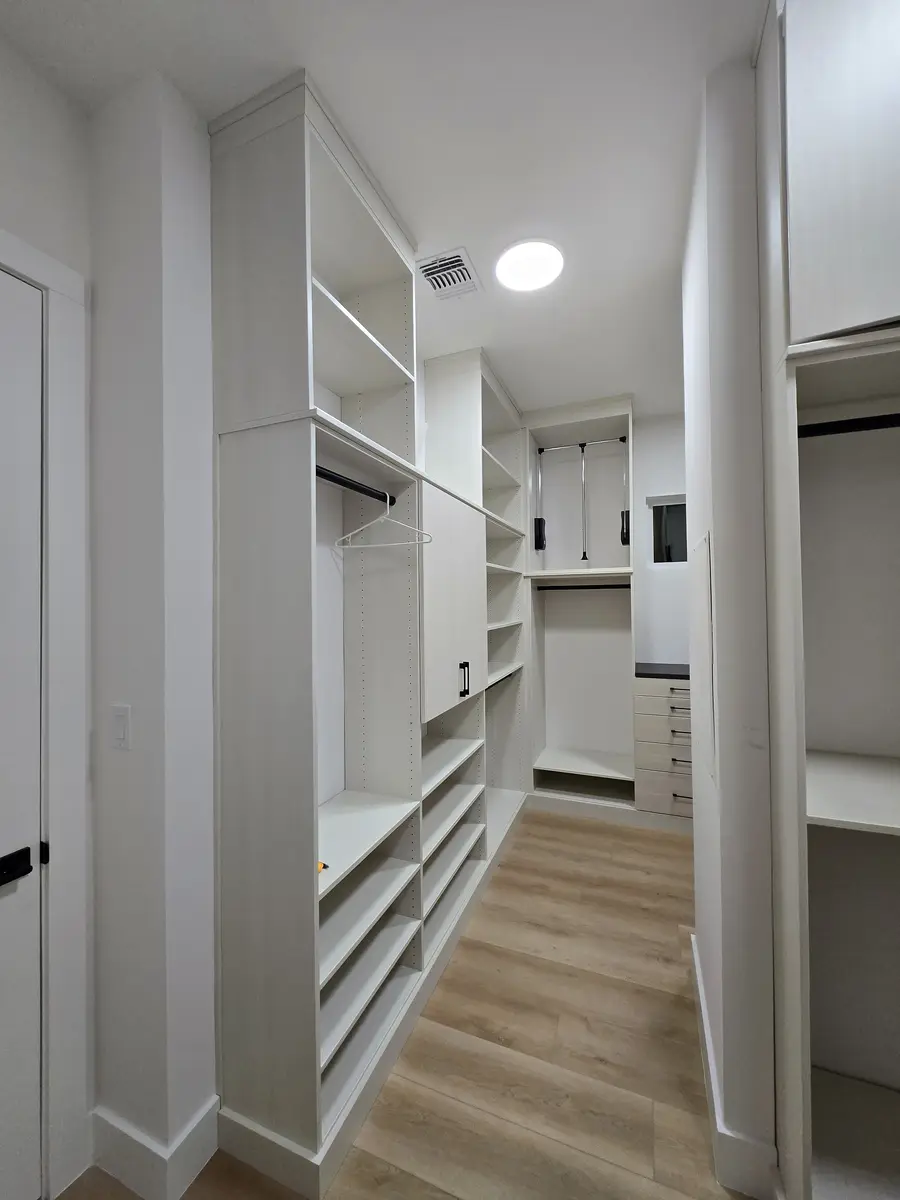 Installed closet system showing a corner return with adjustable shelving