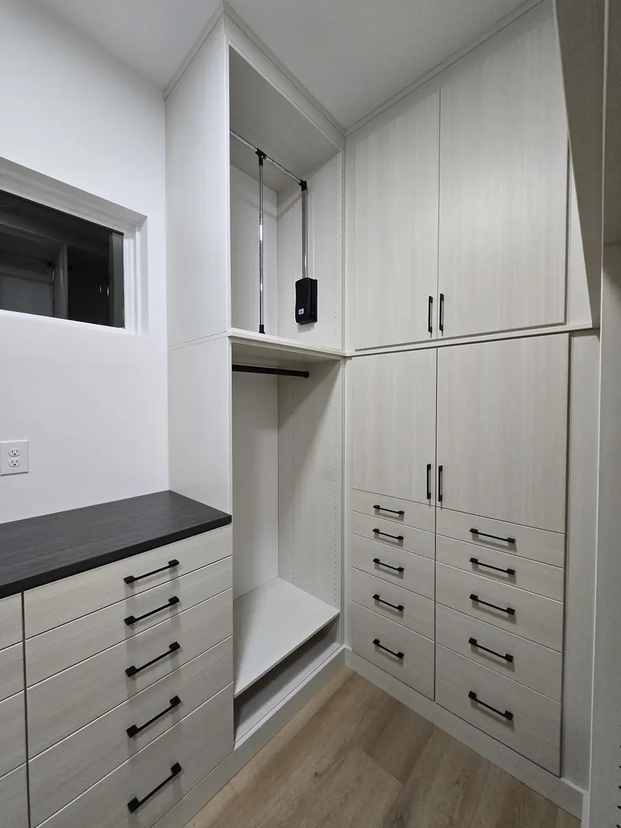 Installed closet system with a drawer bank and shelf tower