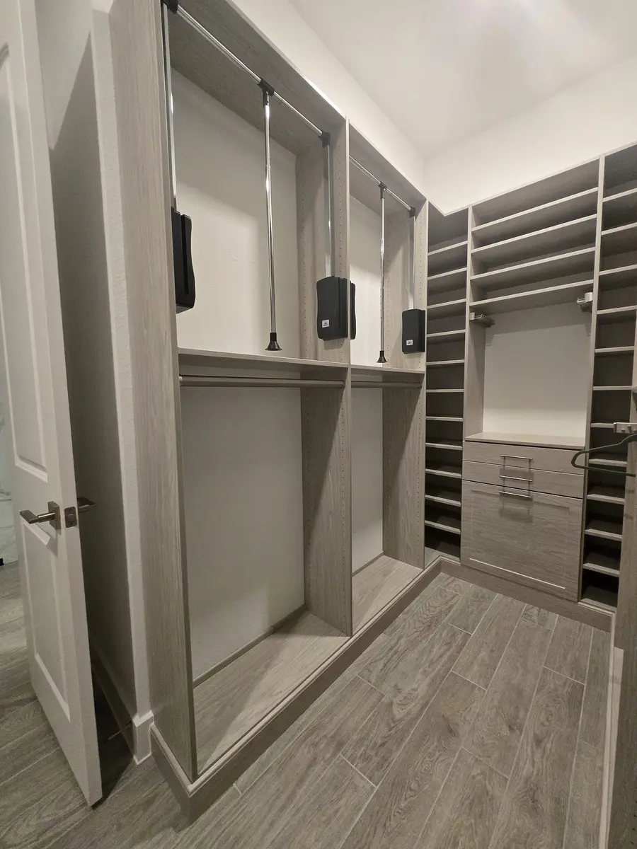 Installed closet system showing a corner return with adjustable shelving