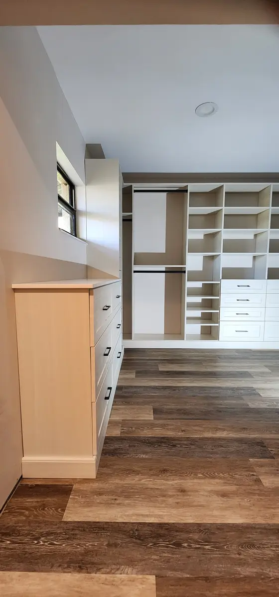 Installed closet system with a drawer bank and shelf tower