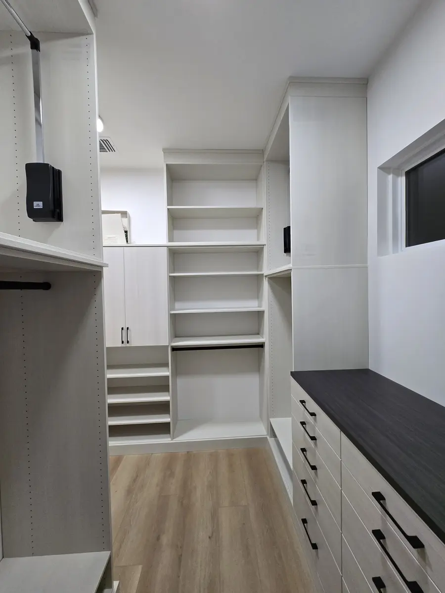 Installed closet system with a drawer bank and shelf tower