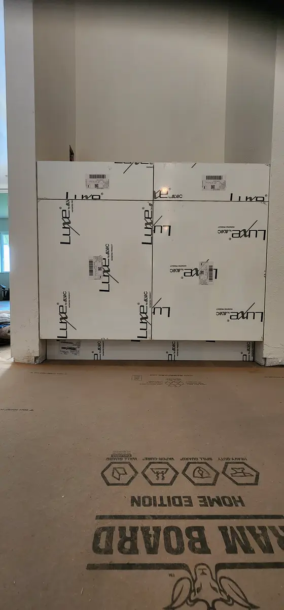 Cabinet material staged in an unfinished unit before installation