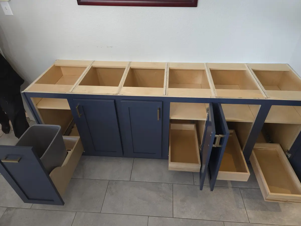 Cabinet material staged in an unfinished unit before installation
