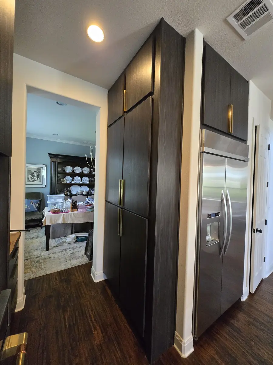 Installed kitchen with cabinet runs and appliance surrounds
