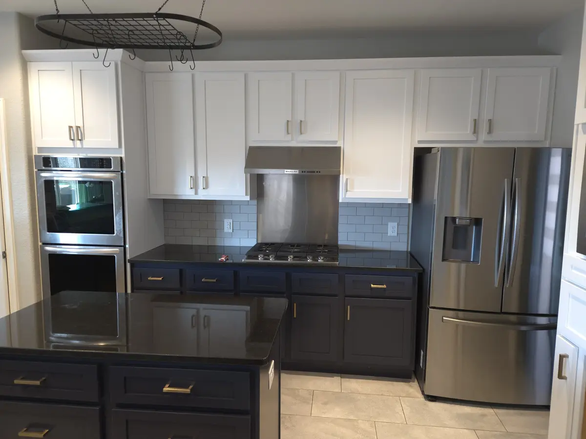 Installed kitchen with cabinet runs and appliance surrounds