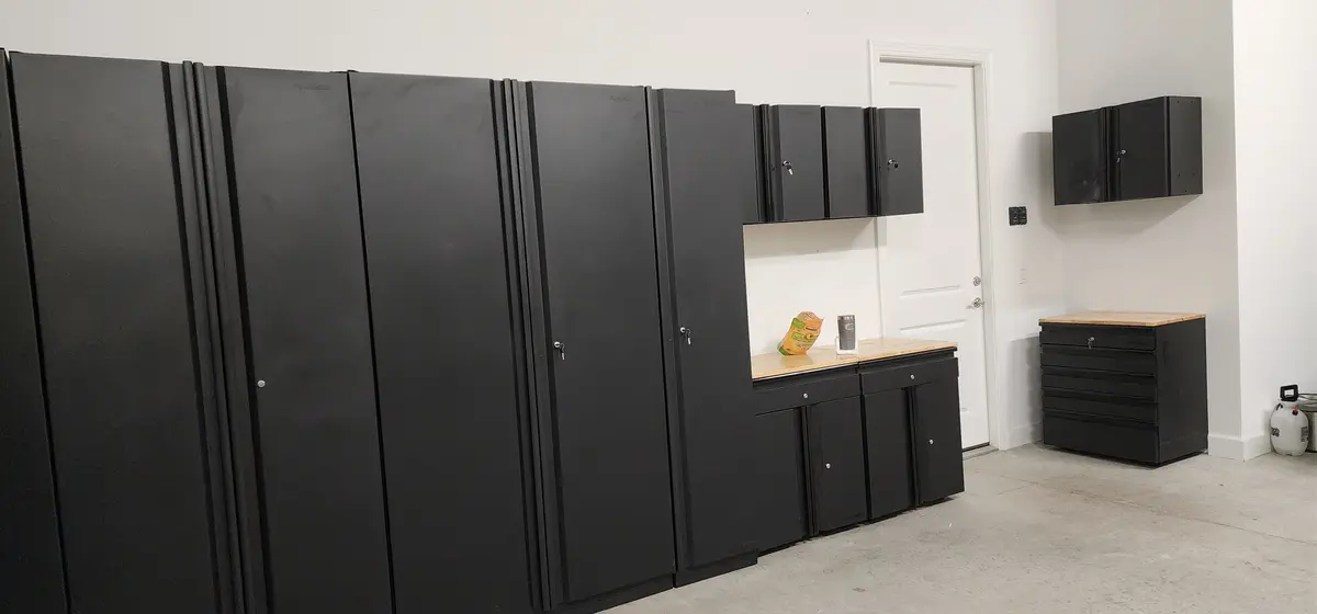 Installed storage cabinetry with overhead units and base cabinets