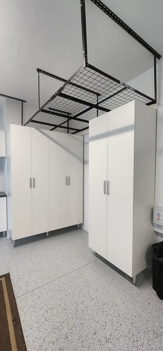 Installed storage cabinetry with overhead units and base cabinets