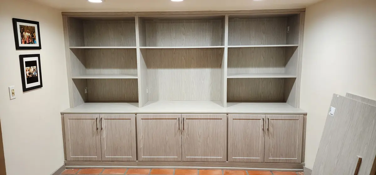 Installed built-in millwork with applied trim and adjustable shelving