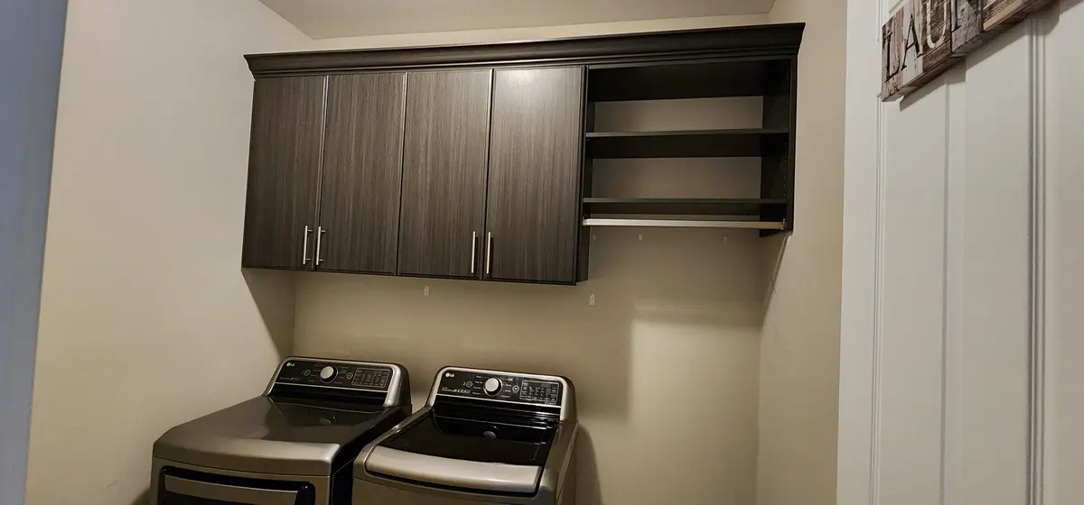 Installed built-in cabinetry with a finished top and finished edges