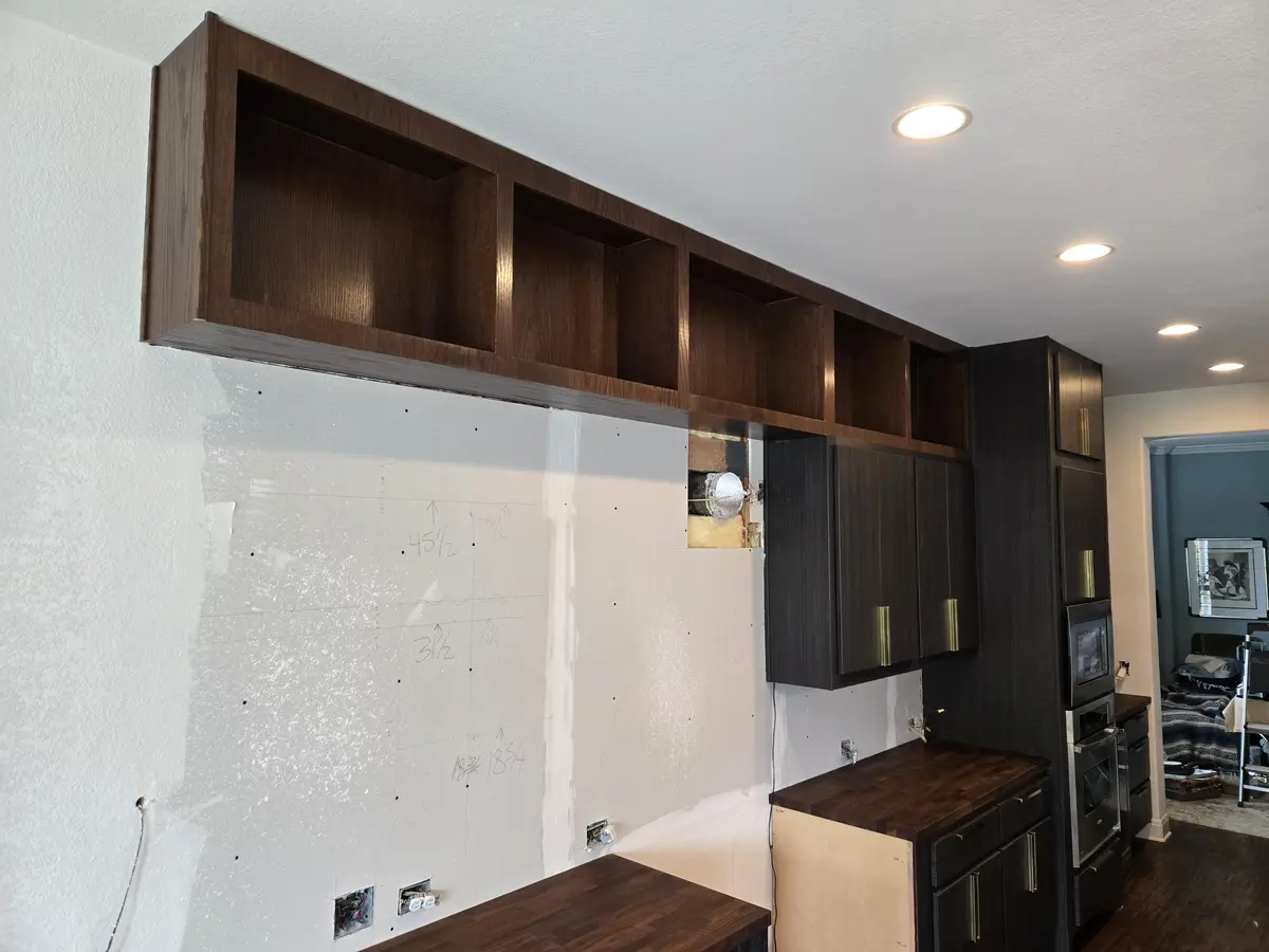 Installed built-in millwork with applied trim and adjustable shelving