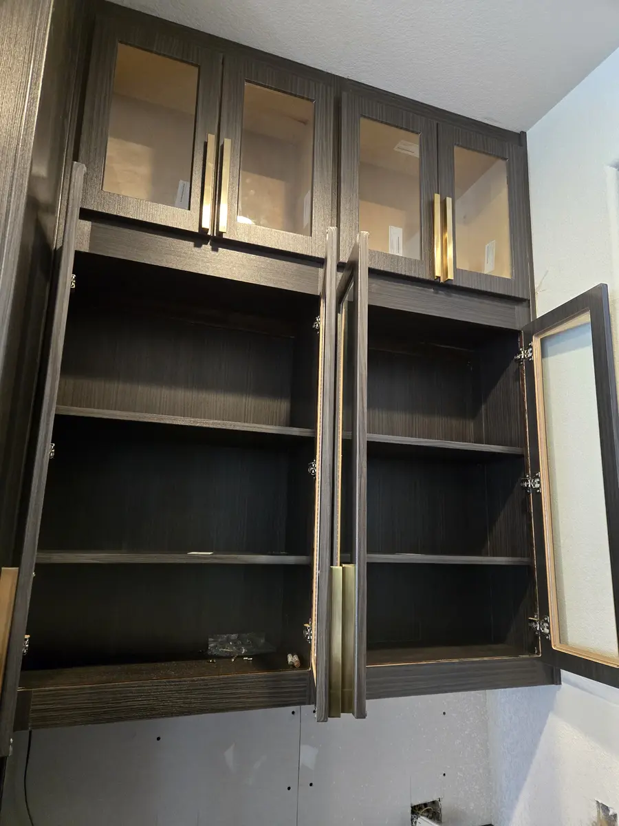 Installed built-in cabinetry with a finished top and finished edges