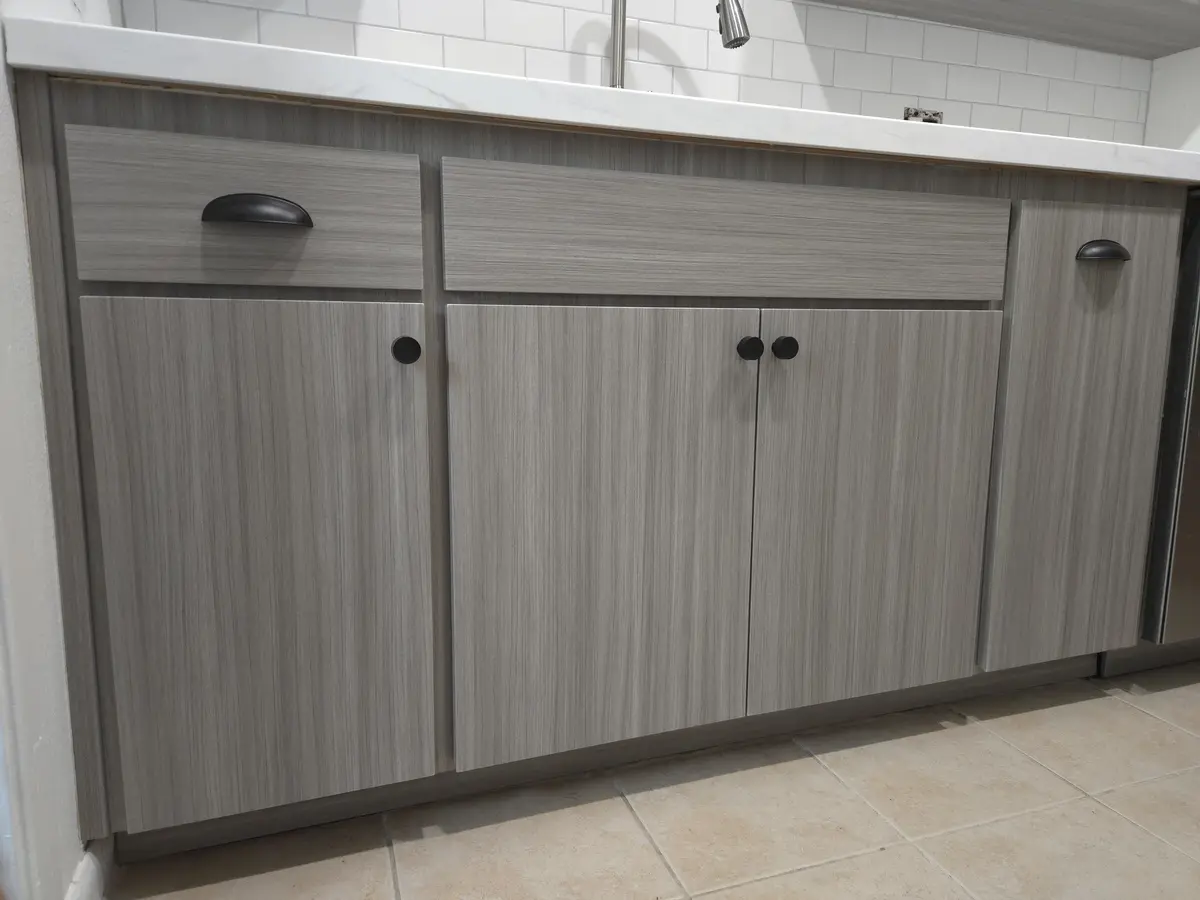 Installed millwork with shelving behind full-height doors
